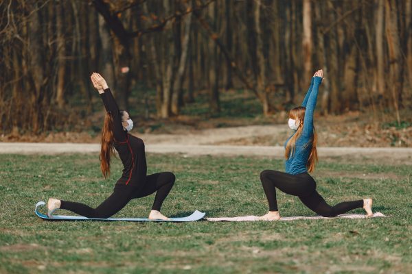 Sportive Girlfriends In Face Masks Standing In Crescent 4127321