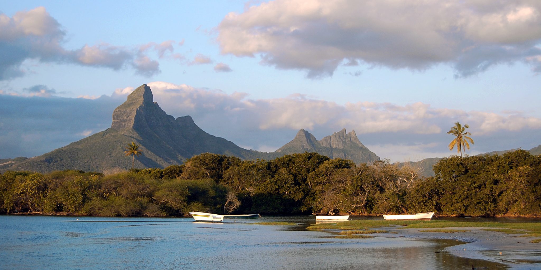 Tamarin Bay Landscape At Sunset With Mountain In Background Tamarin Bay Landscape At Sunset With Mountain In Background